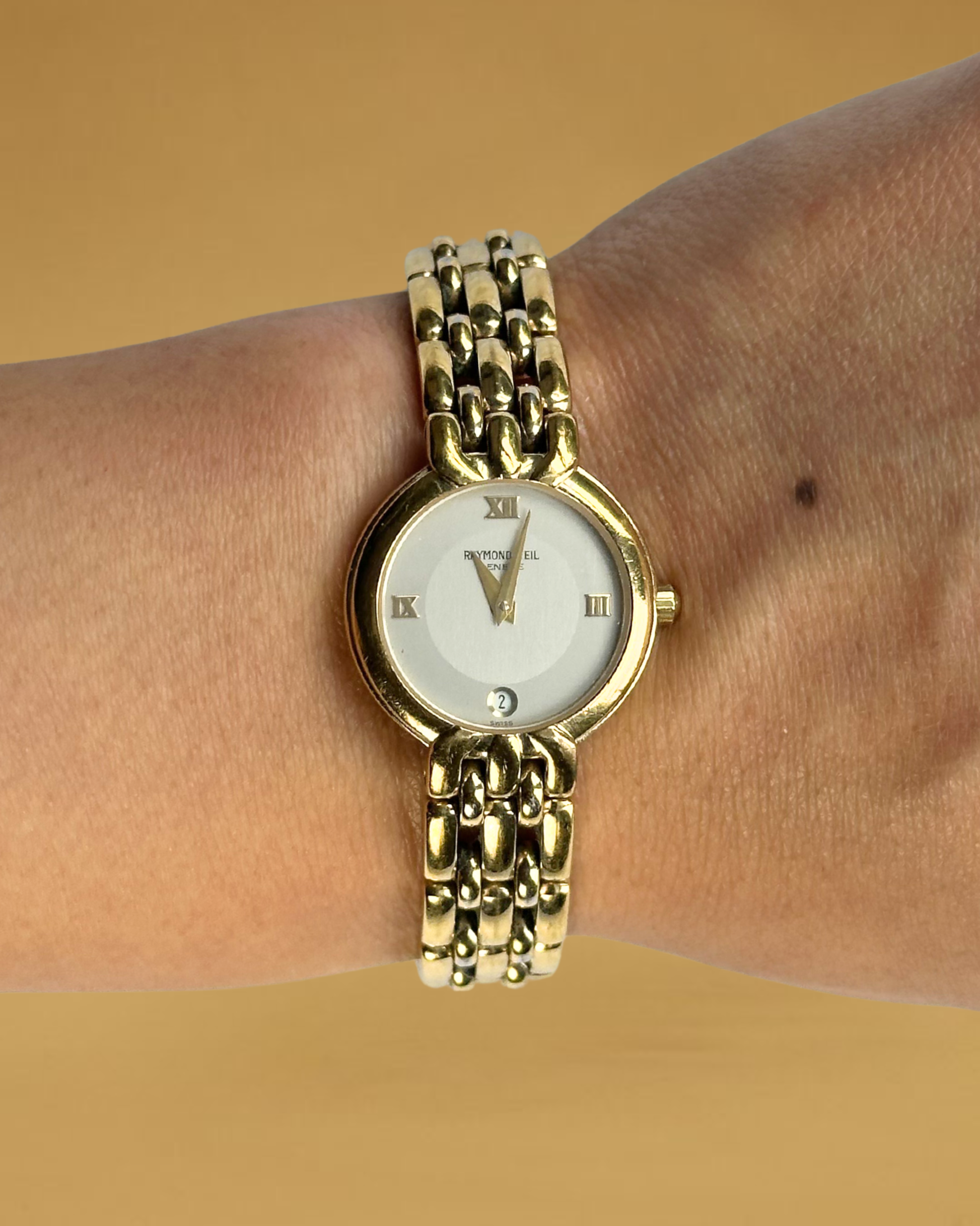 1980s Raymond Weil gold-plated round quartz watch