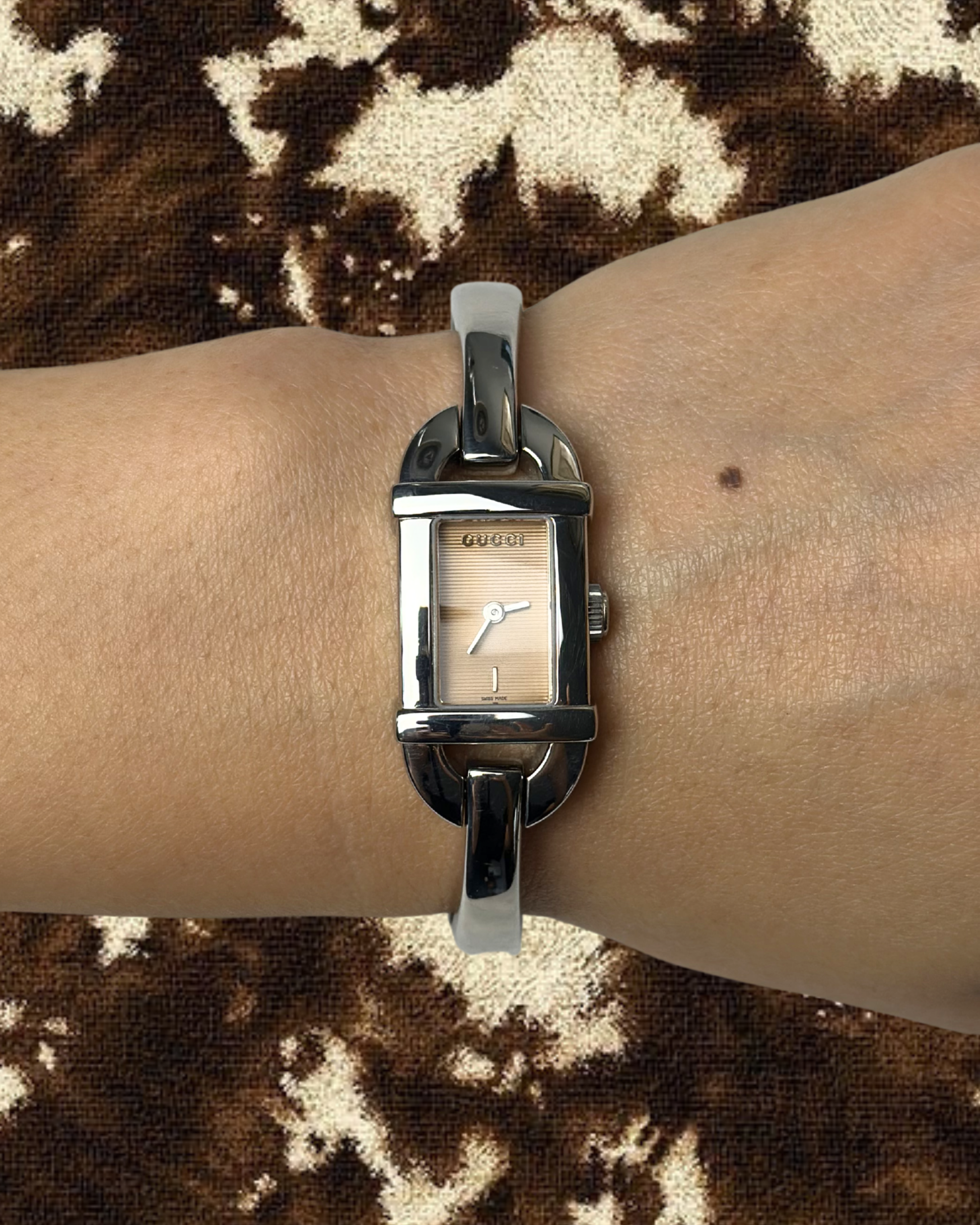 2000s Gucci pink dial silver-tone bangle quartz watch