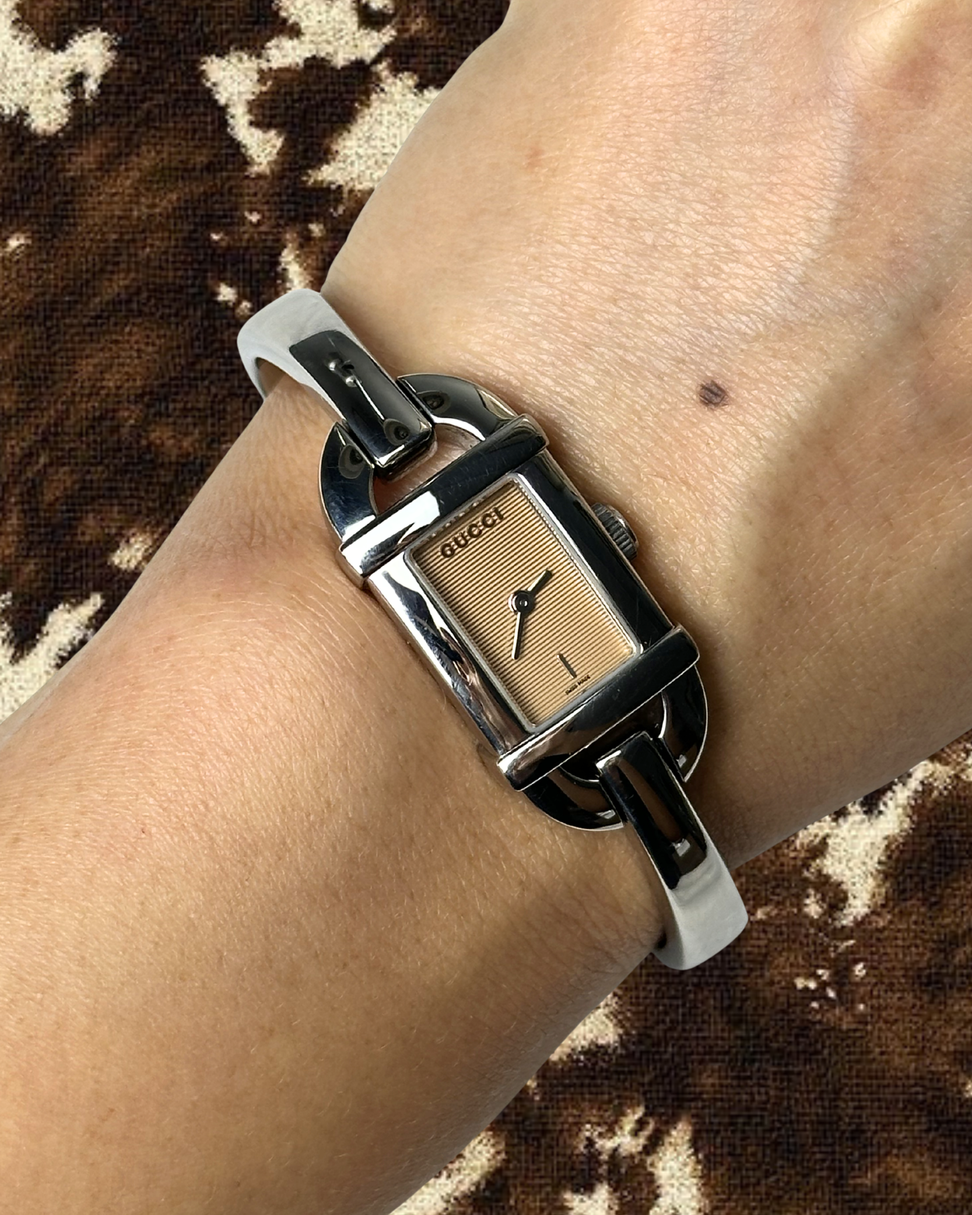 2000s Gucci pink dial silver-tone bangle quartz watch