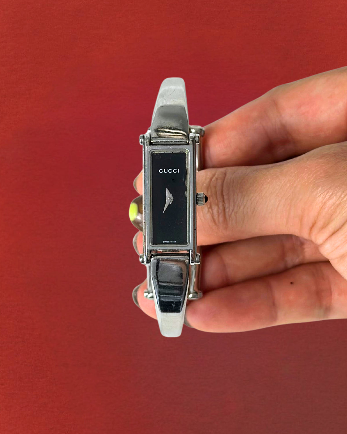 1990s Gucci silver tone black dial bangle watch