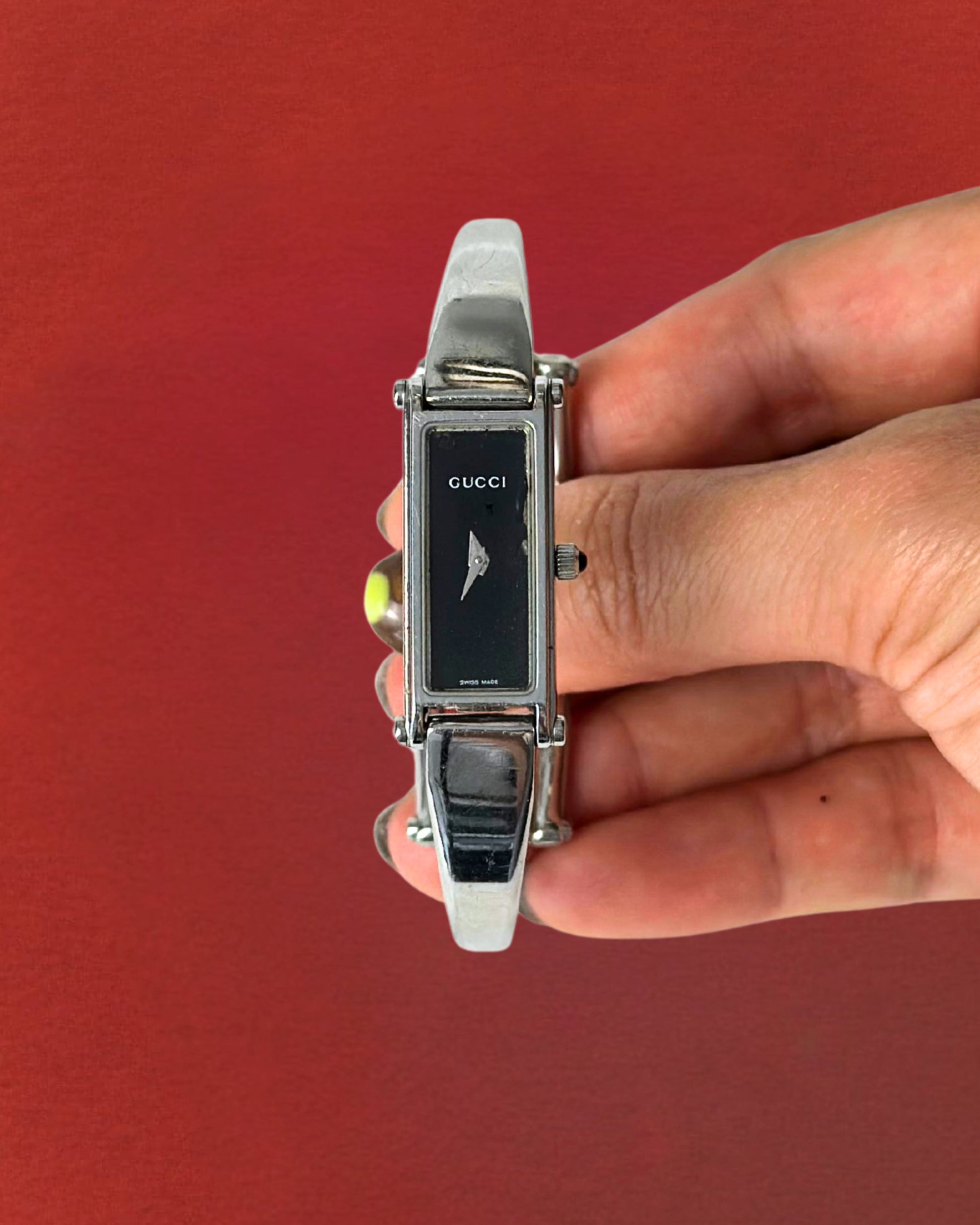 1990s Gucci silver tone black dial bangle watch