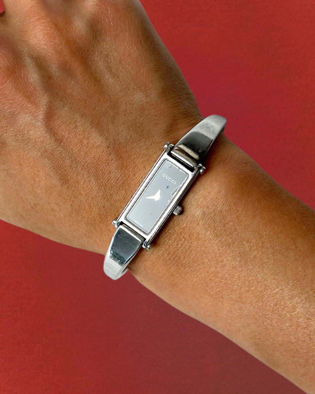 1990s Gucci silver tone black dial bangle watch