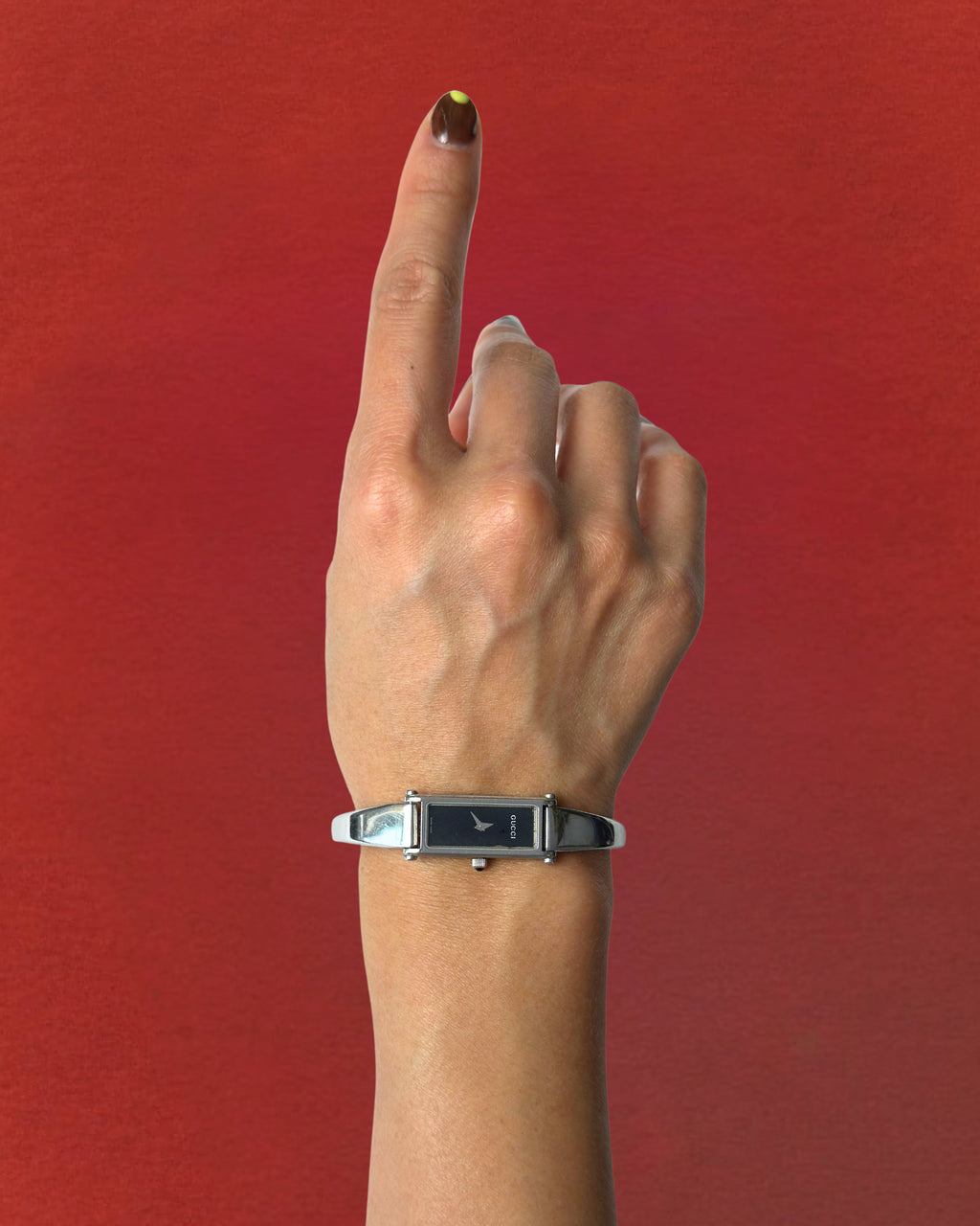 1990s Gucci silver tone black dial bangle watch