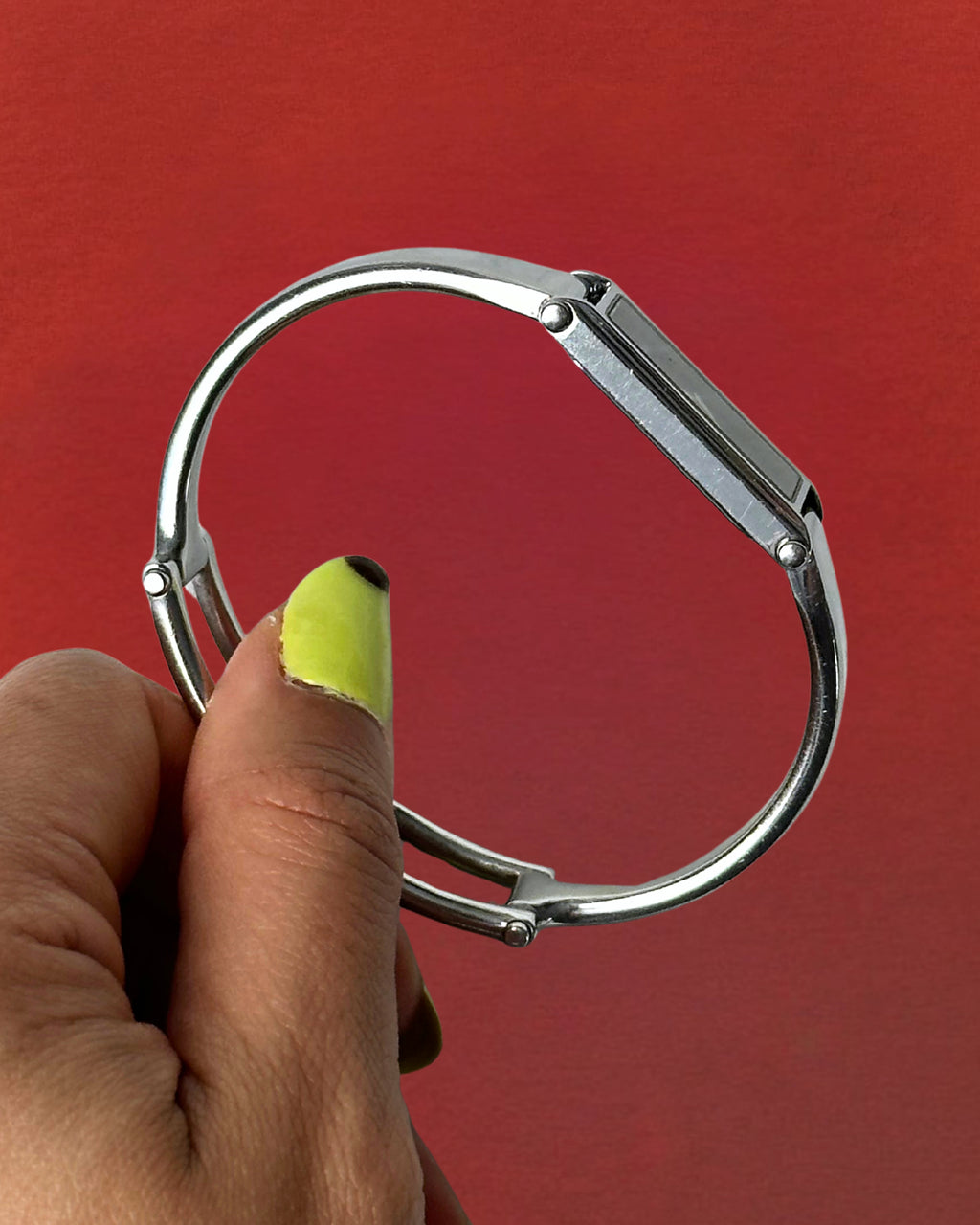 1990s Gucci silver tone black dial bangle watch