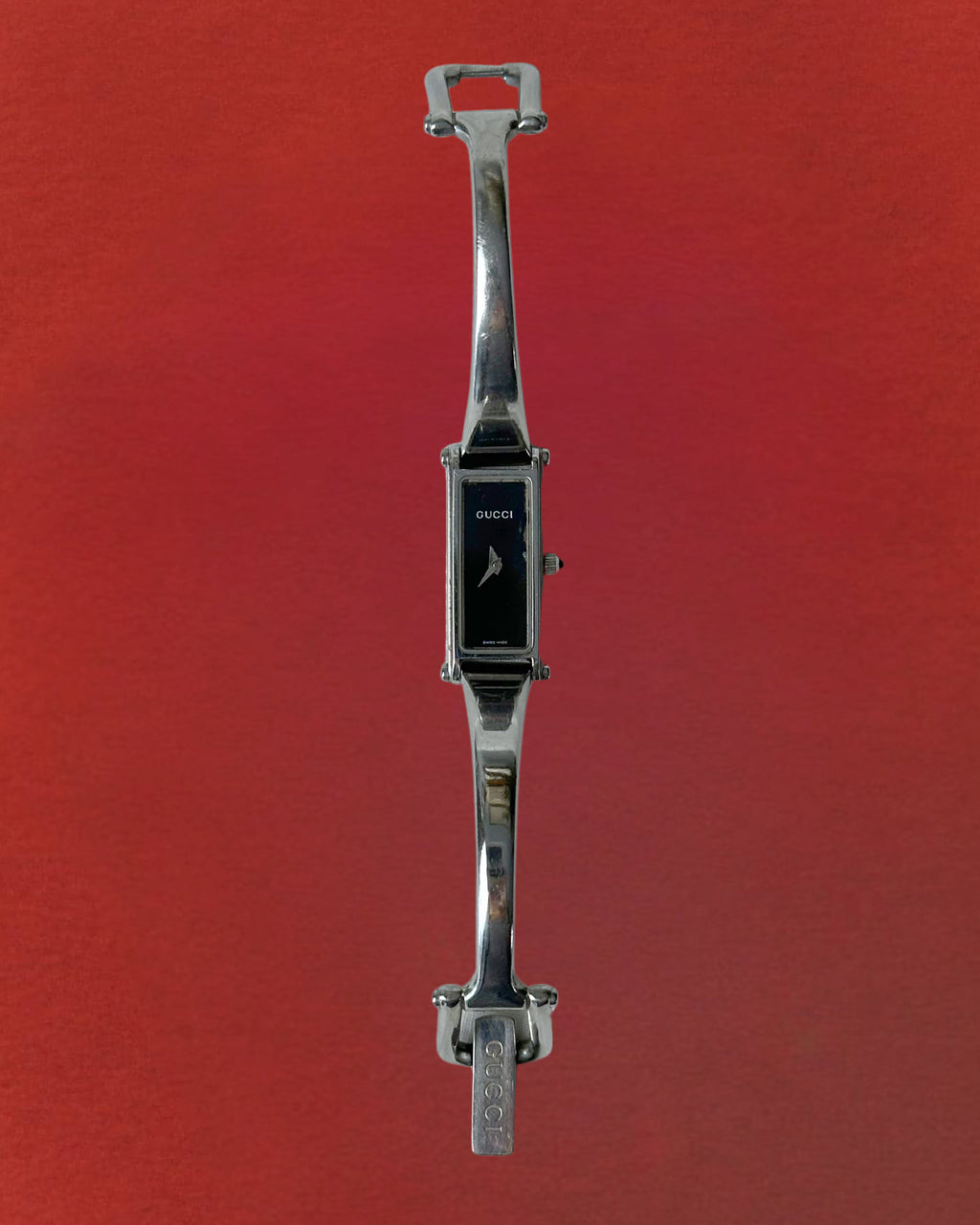 1990s Gucci silver tone black dial bangle watch