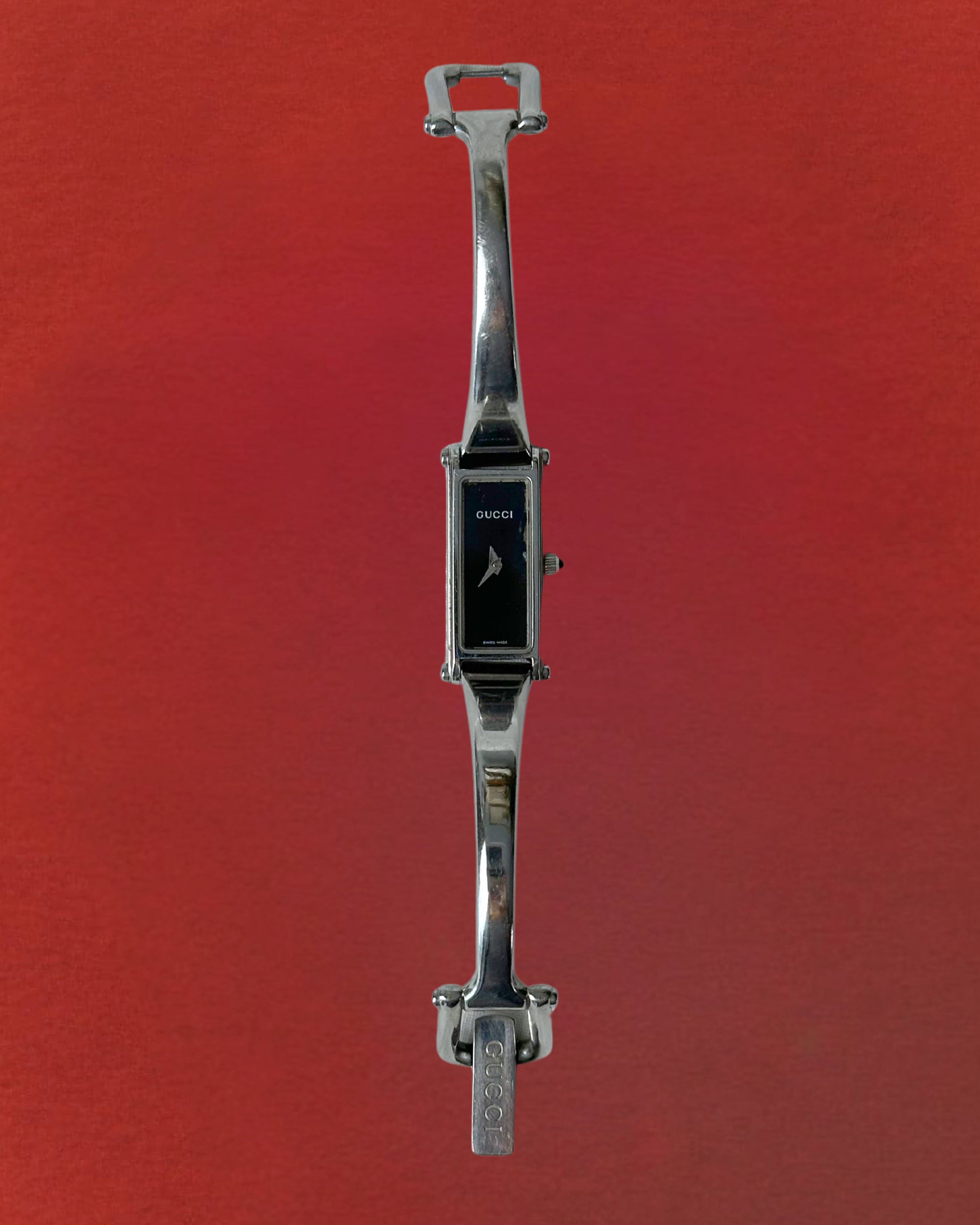 1990s Gucci silver tone black dial bangle watch