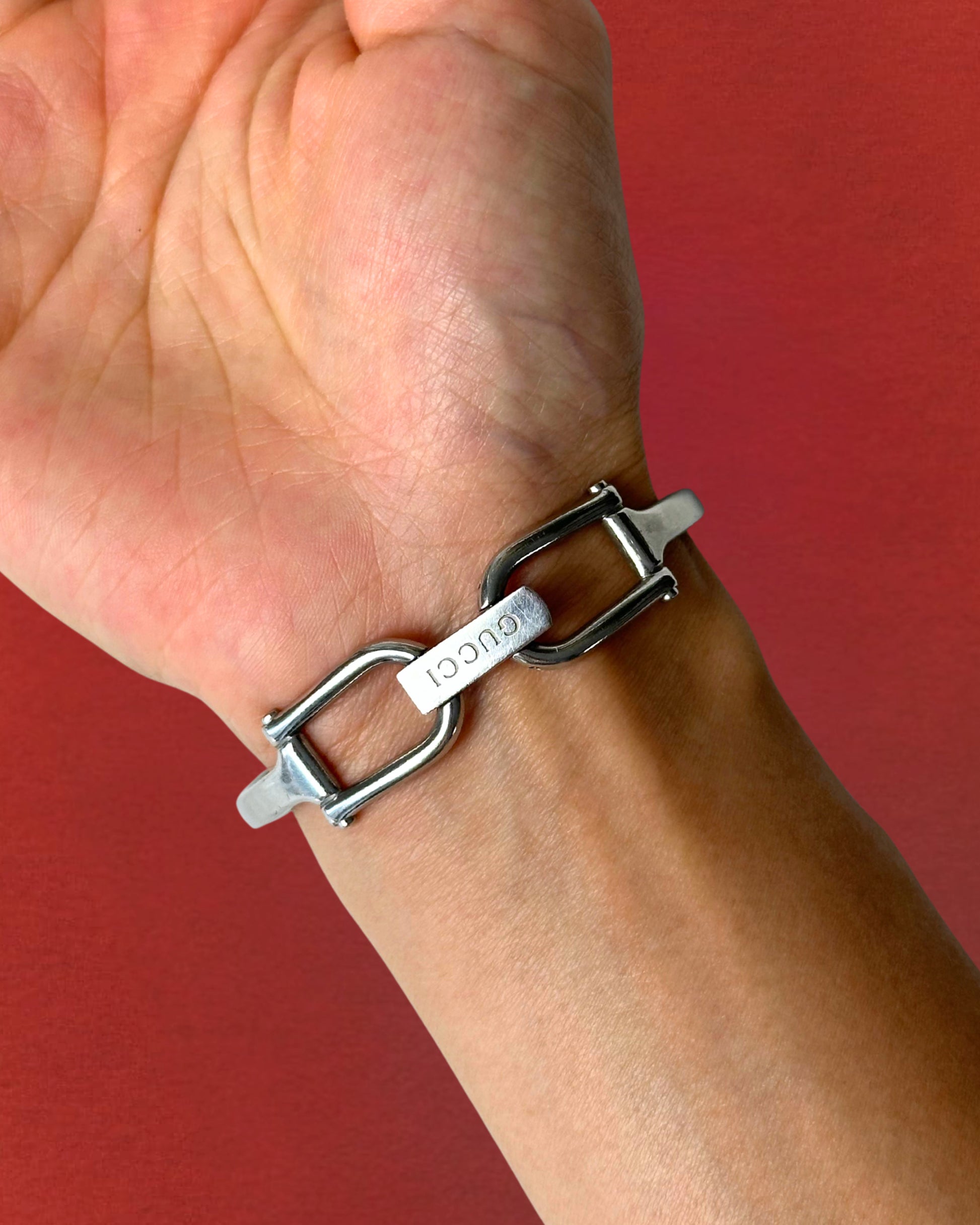 1990s Gucci silver tone black dial bangle watch