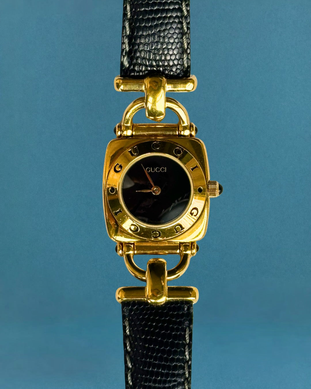 1990s Gucci gold and black leather quartz watch