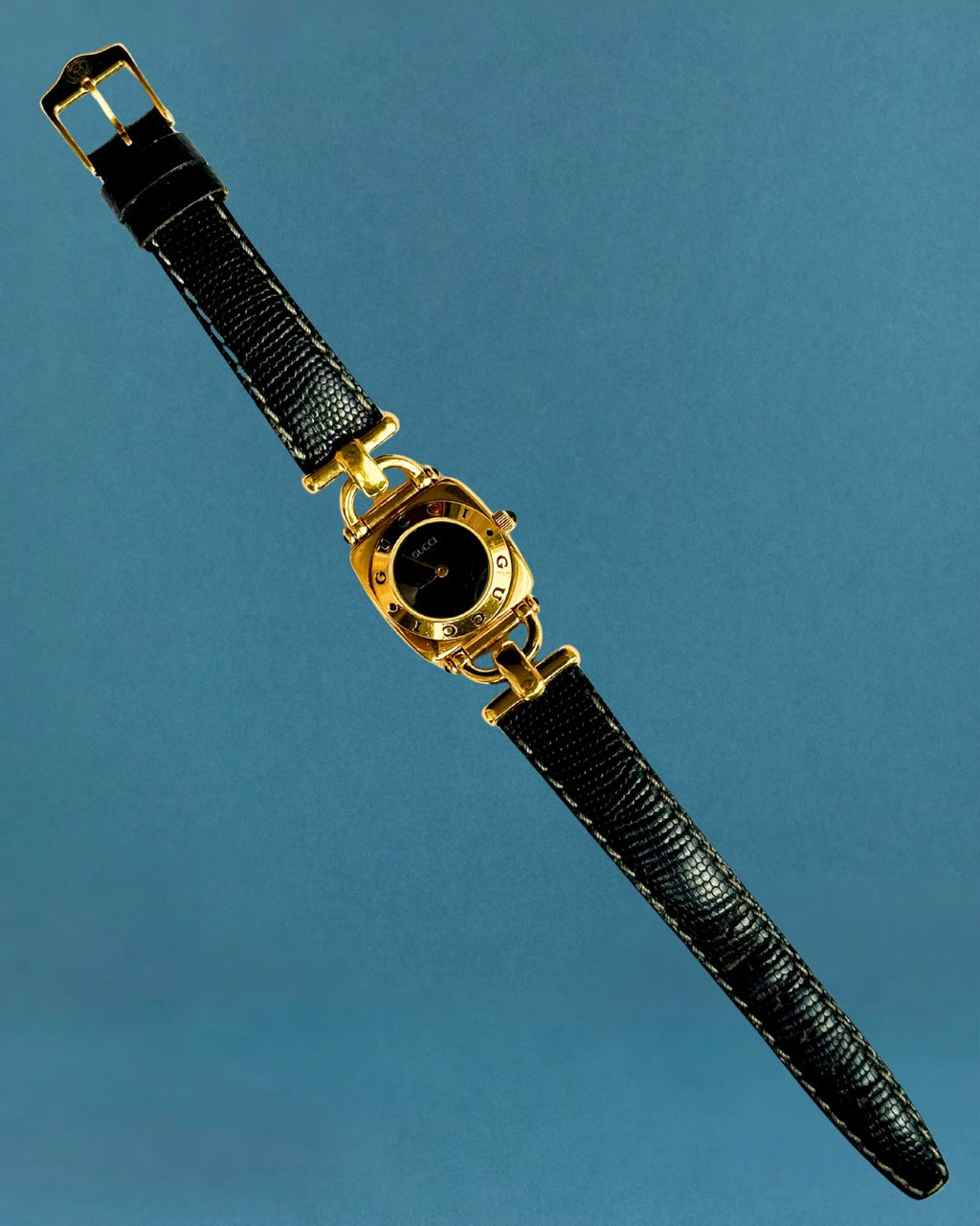 1990s Gucci gold and black leather quartz watch