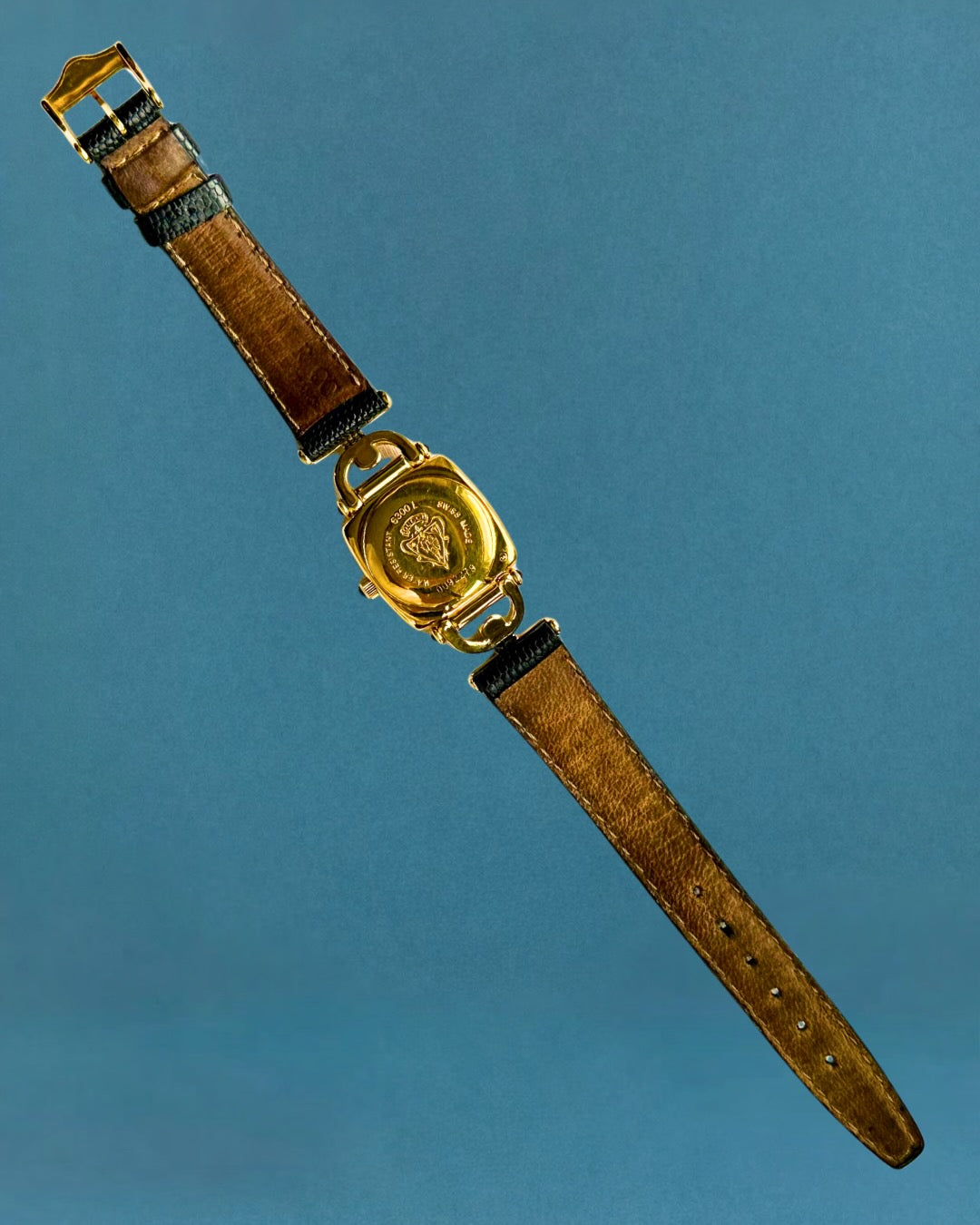 1990s Gucci gold and black leather quartz watch