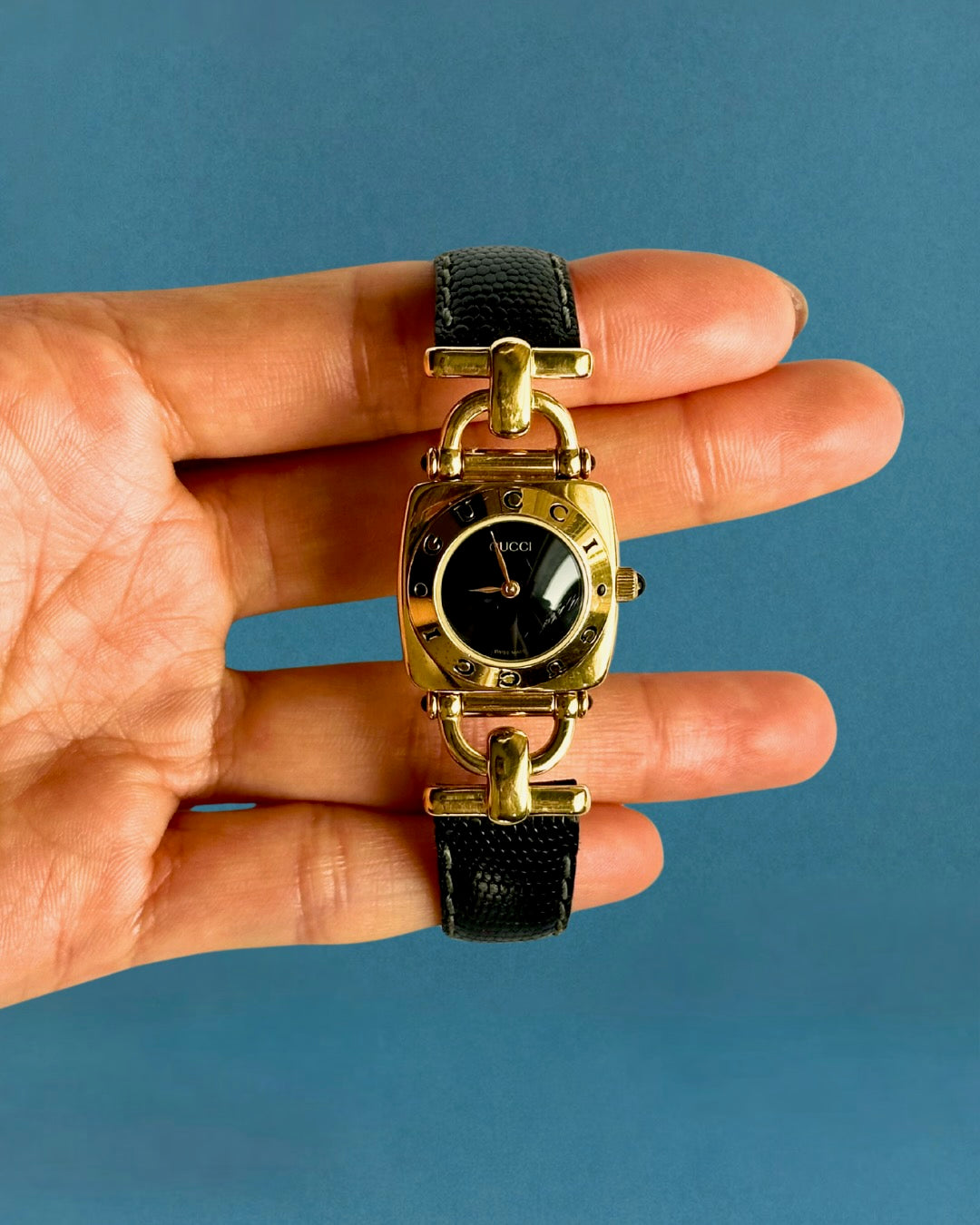 1990s Gucci gold and black leather quartz watch