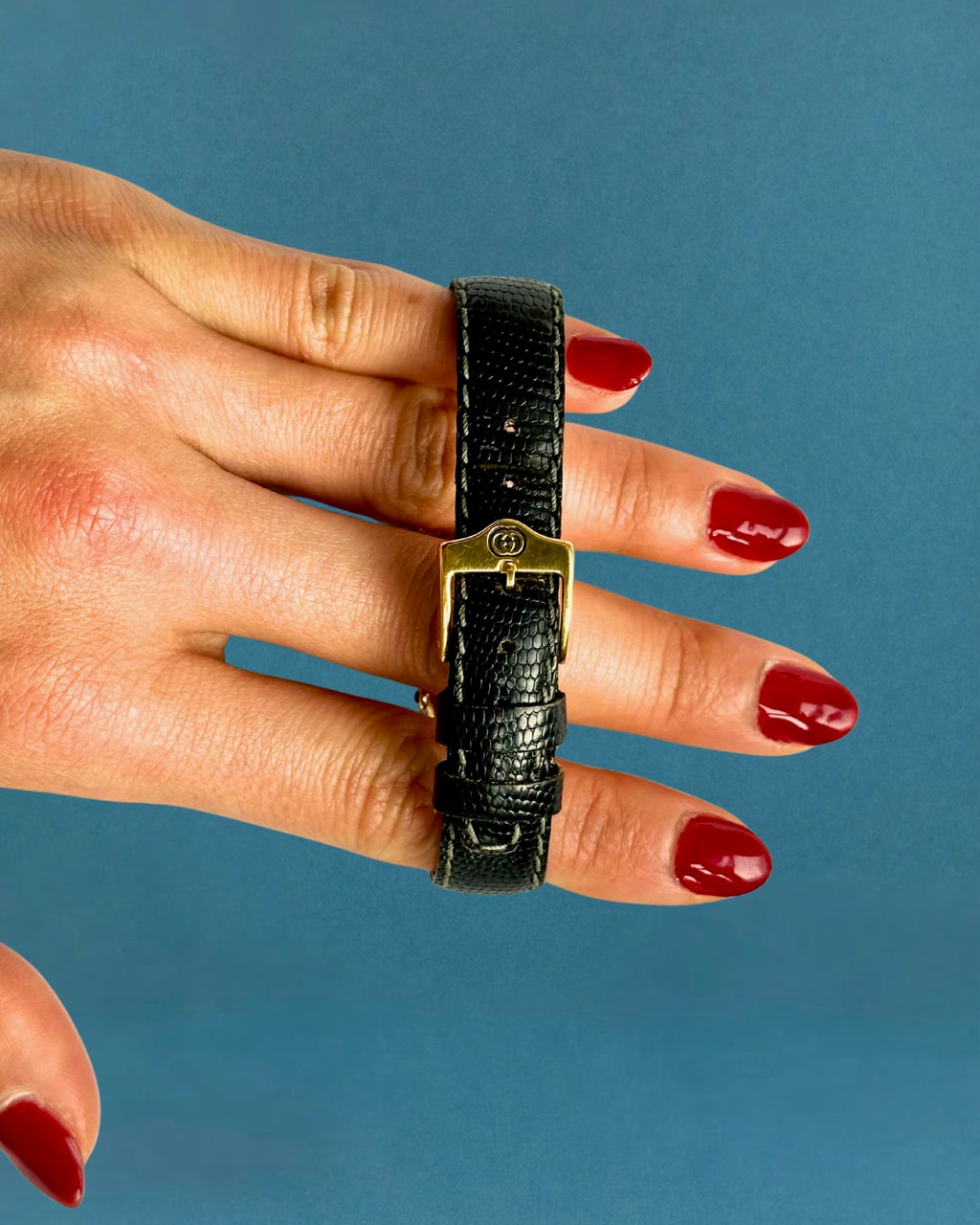 1990s Gucci gold and black leather quartz watch