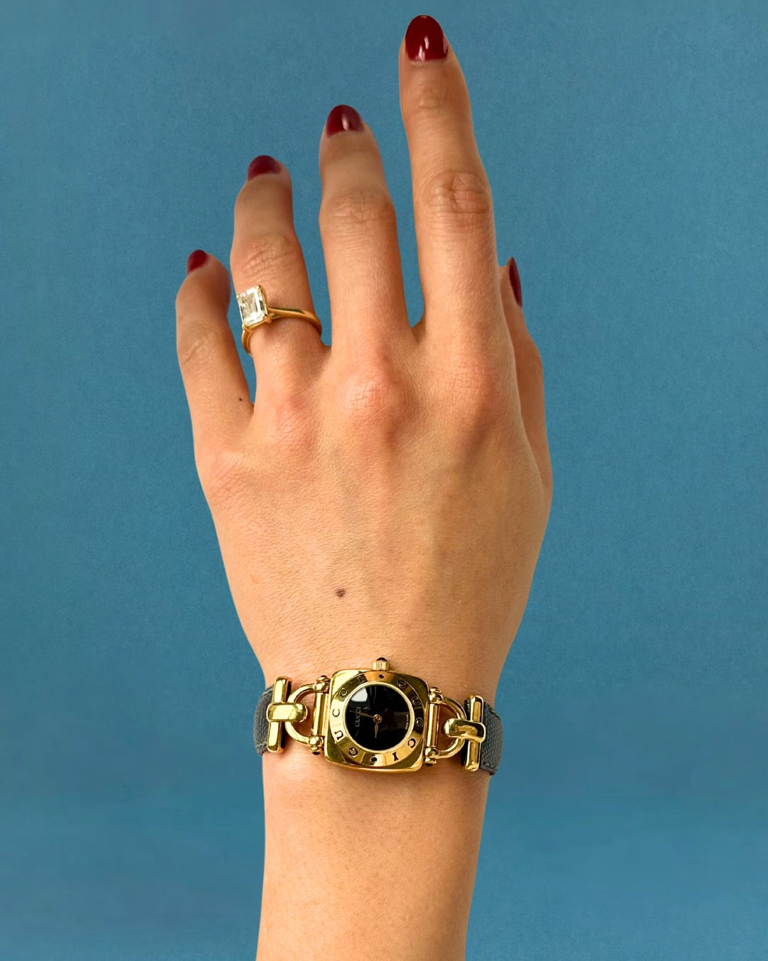 1990s Gucci gold and black leather quartz watch