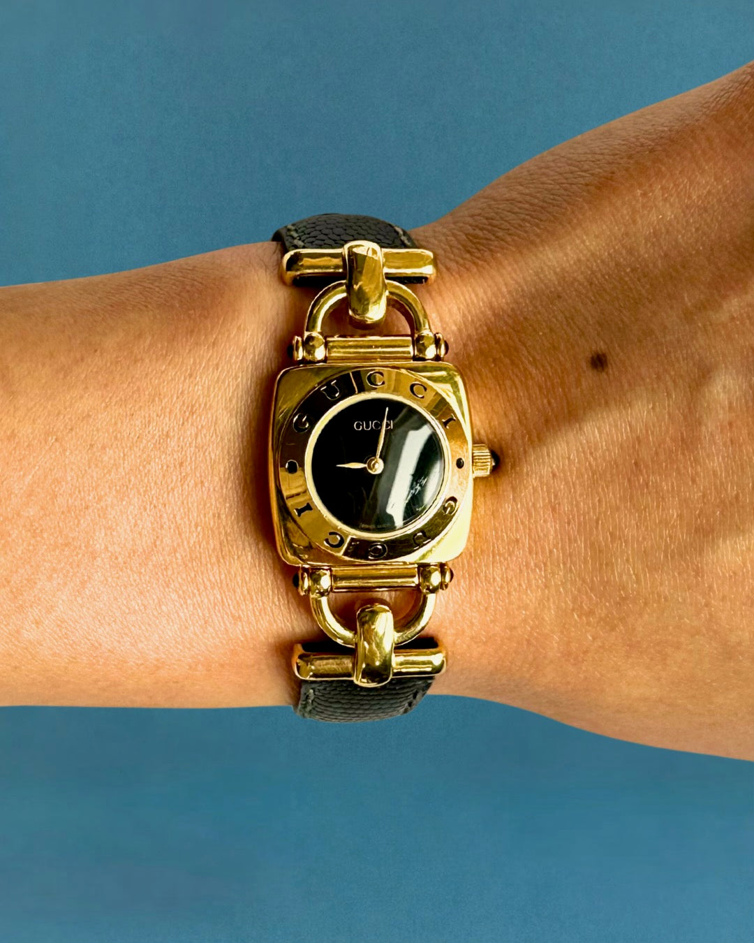 1990s Gucci gold and black leather quartz watch
