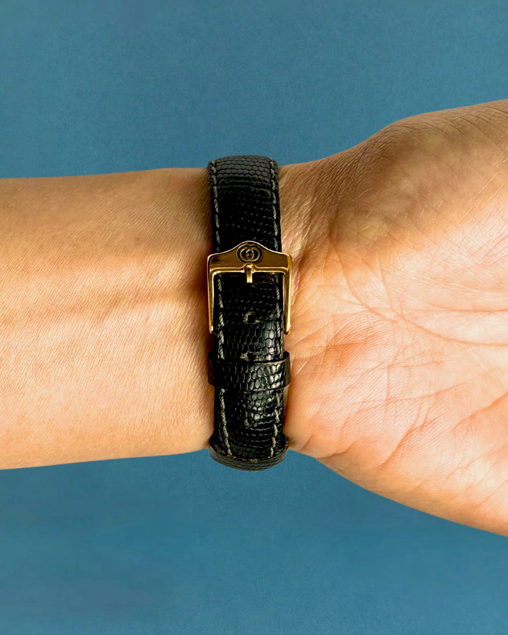 1990s Gucci gold and black leather quartz watch