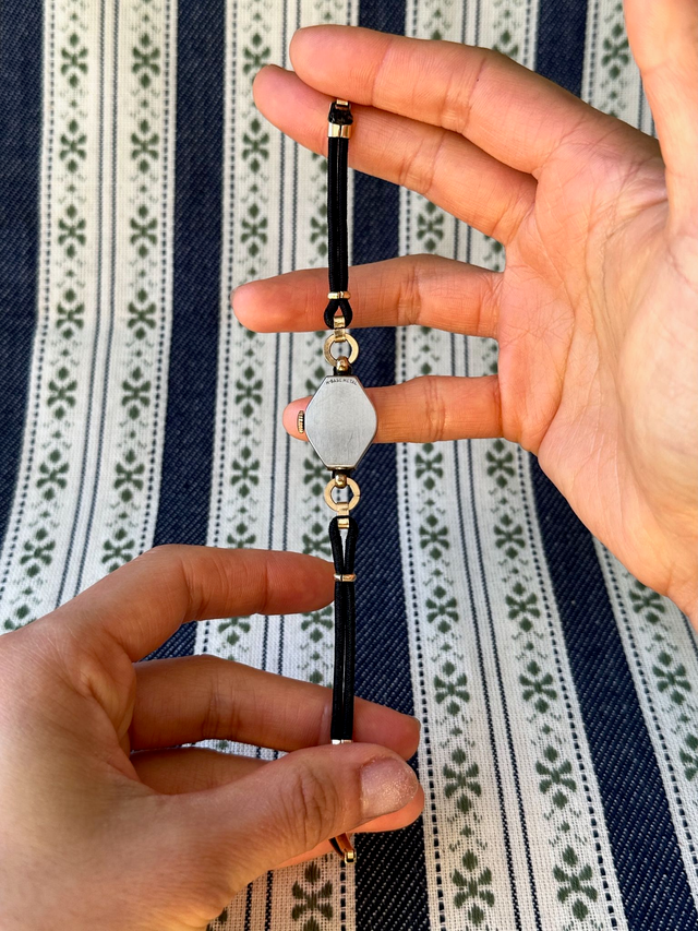 1950s Invicta black cordette mechanical watch