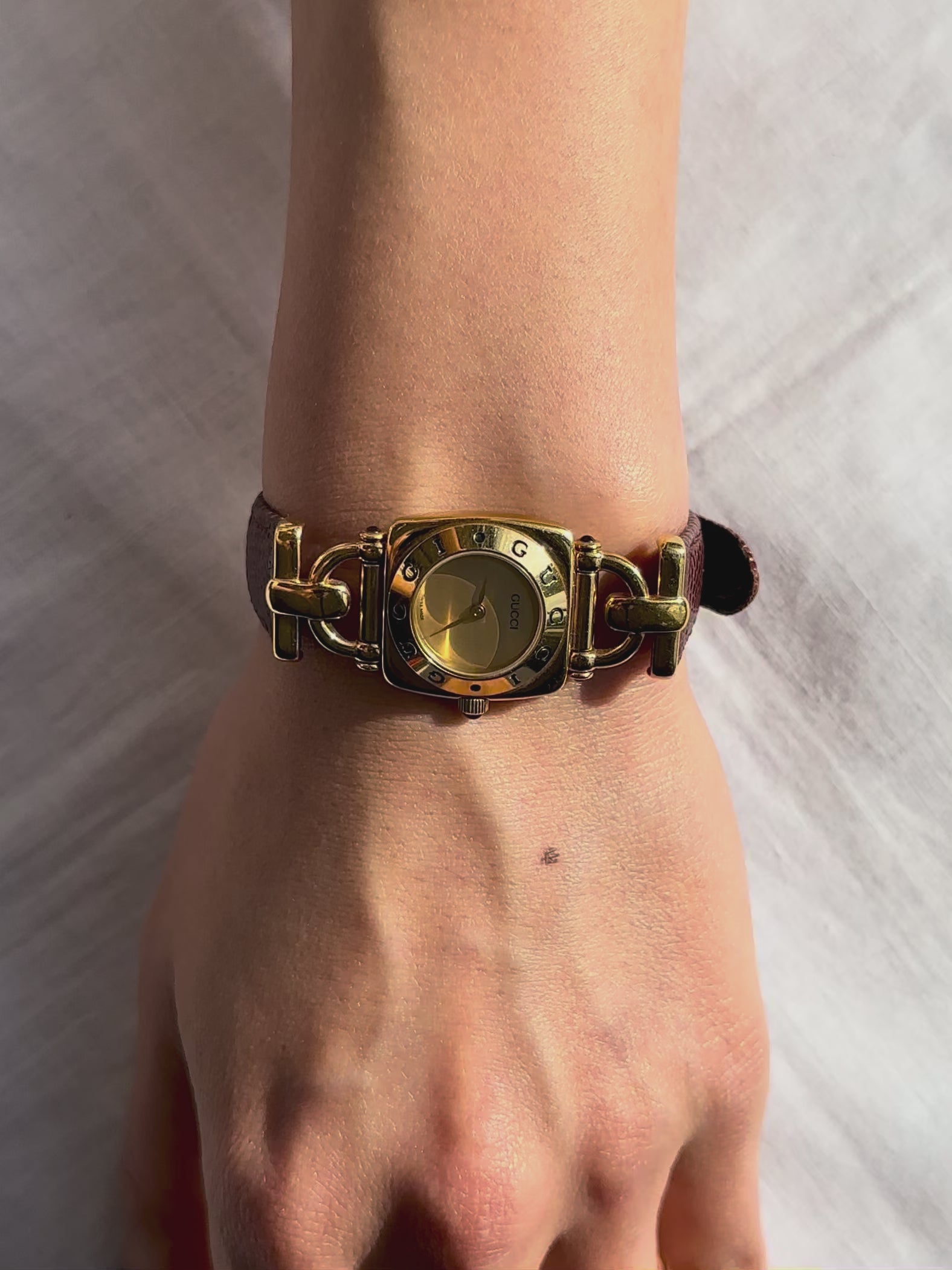 1990s Gucci gold and brown leather quartz watch