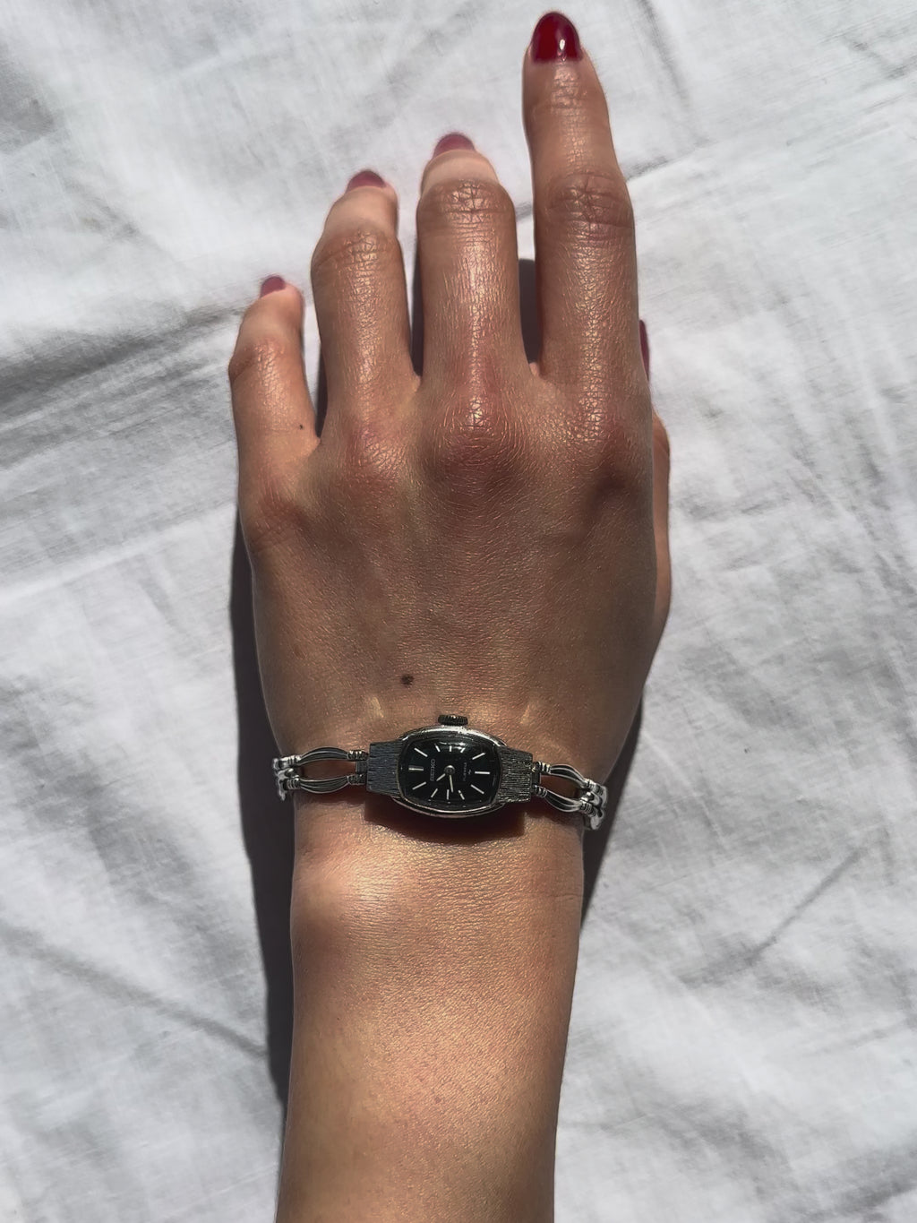 1970s Seiko black dial silver-tone mechanical watch