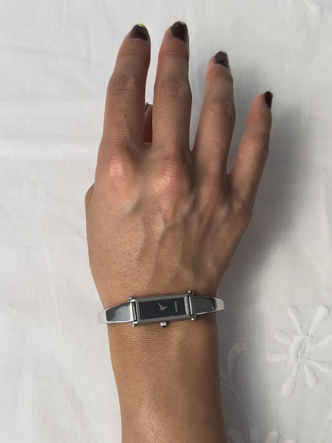 1990s Gucci silver tone black dial bangle watch