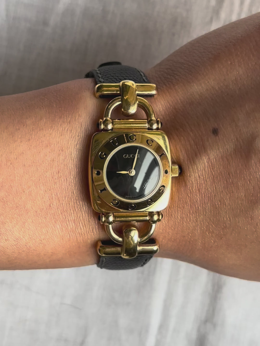 1990s Gucci gold and black leather quartz watch