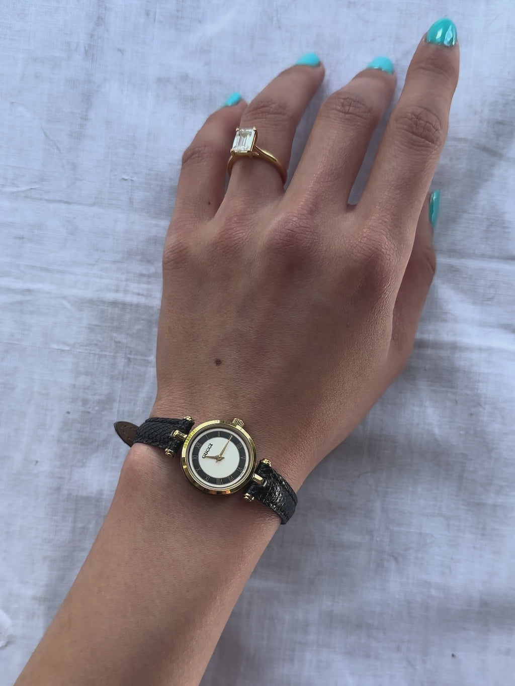 1980s Gucci Roman dial black leather quartz watch