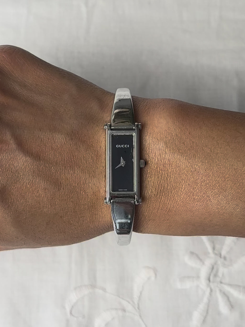 1990s Gucci silver tone black dial bangle watch