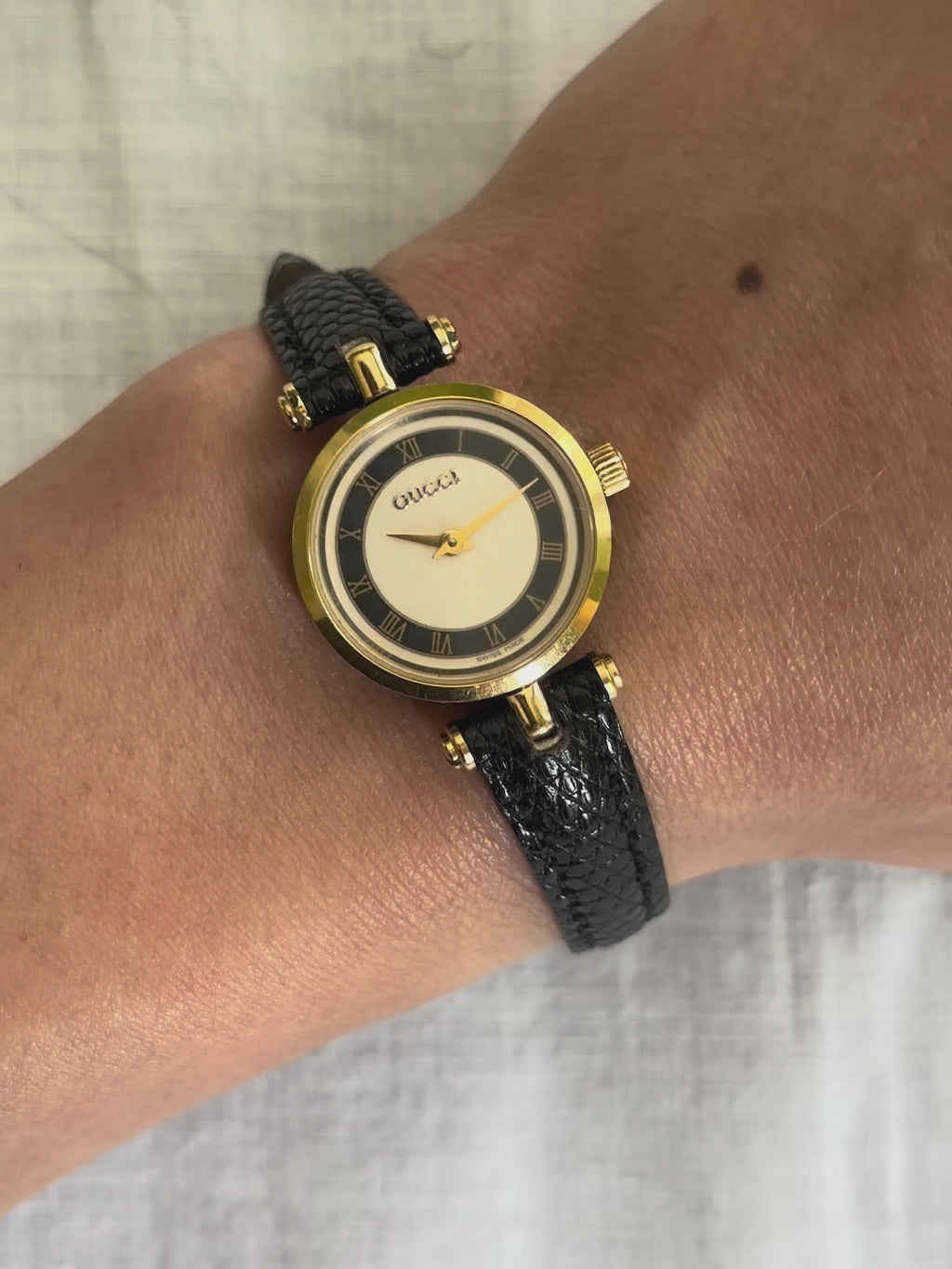 1980s Gucci Roman dial black leather quartz watch