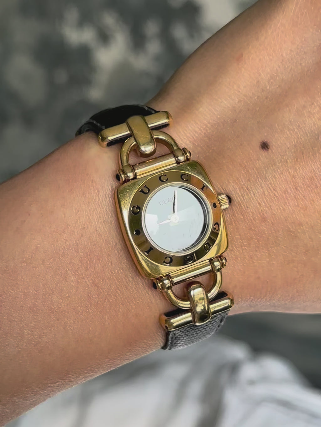 1990s Gucci gold and black leather quartz watch