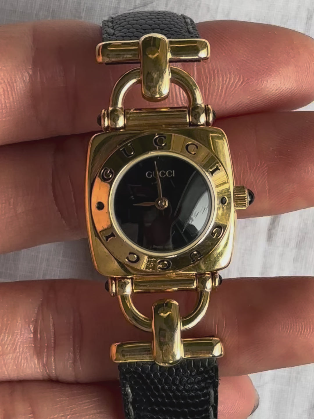 1990s Gucci gold and black leather quartz watch