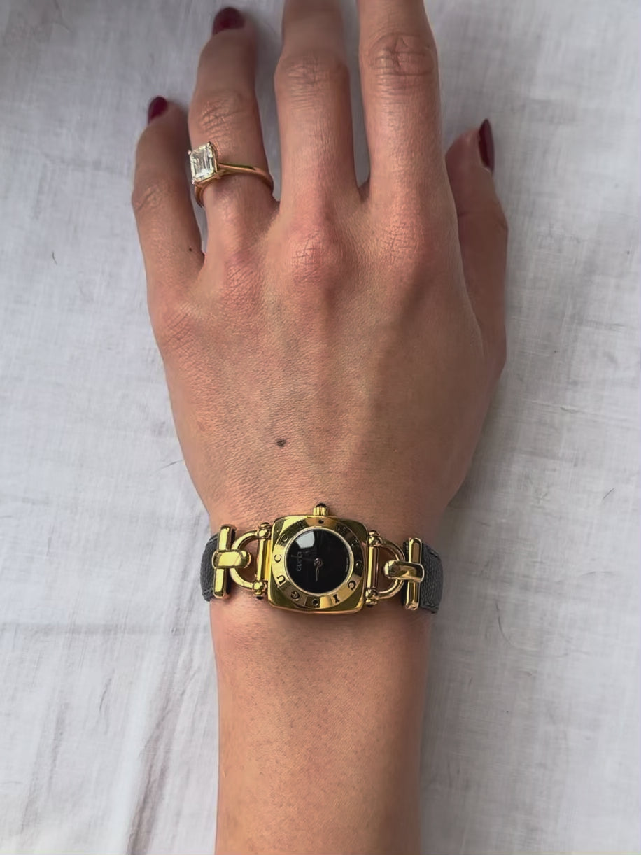 1990s Gucci gold and black leather quartz watch